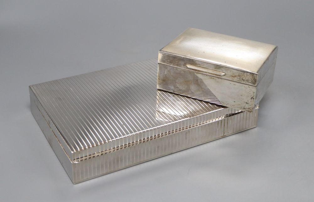 A rhodium plated white metal cigar box, marked STERLING 925 and a silver cigarette box, London 1959